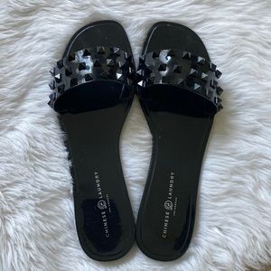 Black jelly sandals by Chinese Laundry